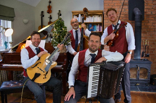 christmas jazz band next to a tree